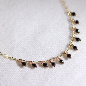 Black Garnet charm necklace in 14 kt. GF