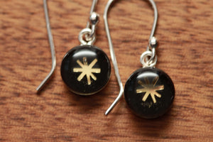 Tiny Black and Gold star earrings made from recycled Starbucks gift cards, sterling silver and resin