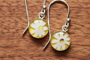 Tiny daisy earrings made from recycled Starbucks gift cards, sterling silver and resin
