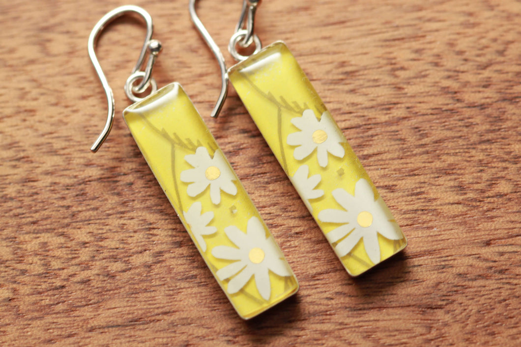 Daisy rectangle earrings made from recycled Starbucks gift cards. sterling silver and resin
