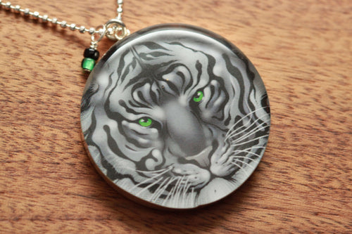 Green eyed Tiger necklace made from recycled Starbucks gift cards, sterling silver and resin