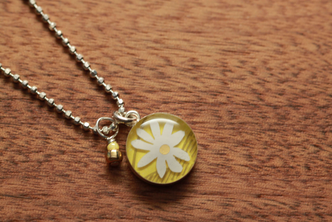 Daisy 12mm necklace made from recycled Starbucks gift cards, sterling silver and resin