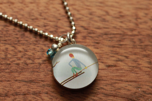 Skiing necklace made from recycled Starbucks gift cards, sterling silver and resin
