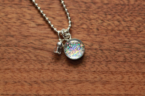 Tiny Rainbow Sparkle necklace made from recycled gift cards, sterling silver and resin