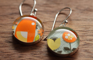 Bird and flower earrings made from recycled Starbucks gift cards. sterling silver and resin
