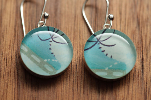Ice skating earrings made from recycled Starbucks gift cards, sterling silver and resin