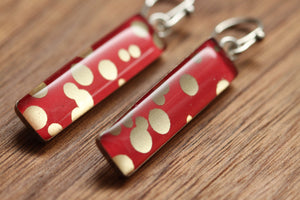 Red and gold polka dot earrings made from recycled Starbucks gift cards, sterling silver and resin
