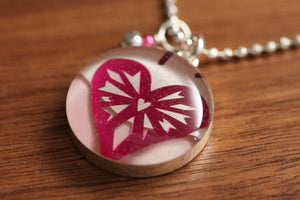 shiny pink heart necklace made from recycled Starbucks gift cards, sterling silver and resin