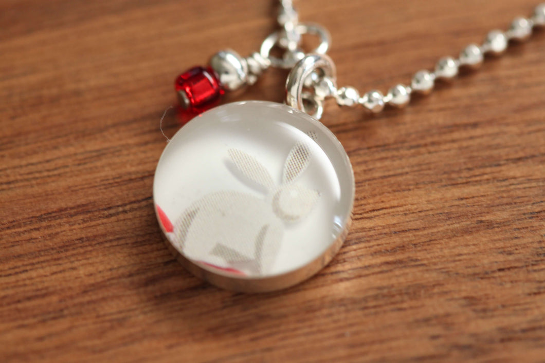 White rabbit necklace made from recycled Starbucks gift cards, sterling silver and resin