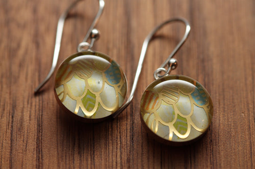 Golden mermaid earrings made from recycled Starbucks gift cards, sterling silver and resin