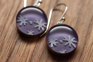 Shimmering snow flake earrings made from recycled Starbucks gift cards, sterling silver and resin